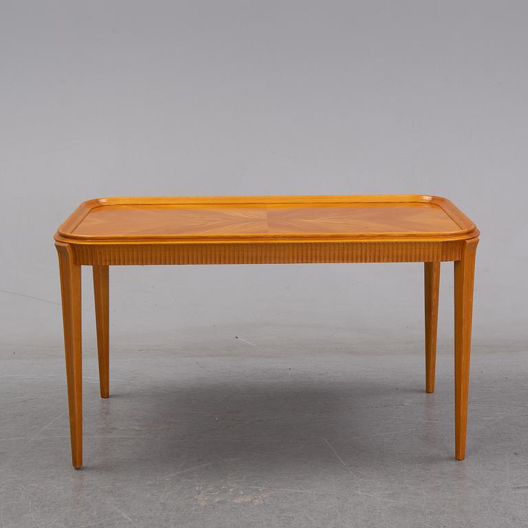 An elm Swedish Modern coffee table, dated 11 11 1947.