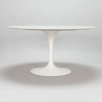 Eero Saarinen, a 1970s 'Tulip' marble-top table with six chairs.