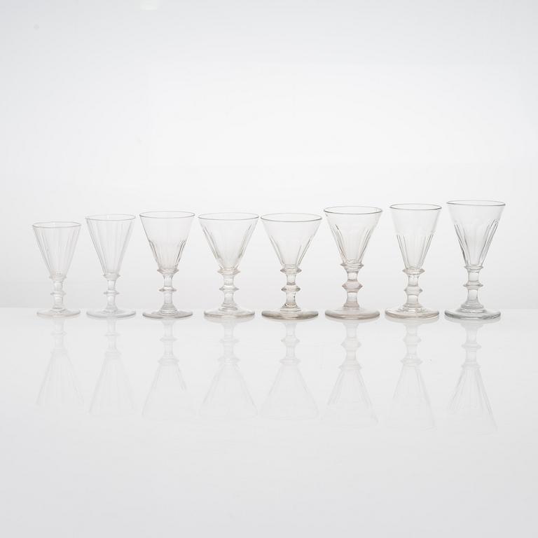 A set of 19 similar drinking glasses from the turn of the 19th/20th century.