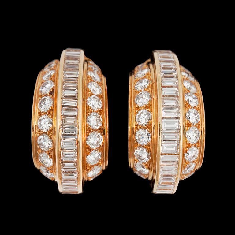 A pair of Cartier diamond earrings. Total carat weigh circa 5.00 cts.