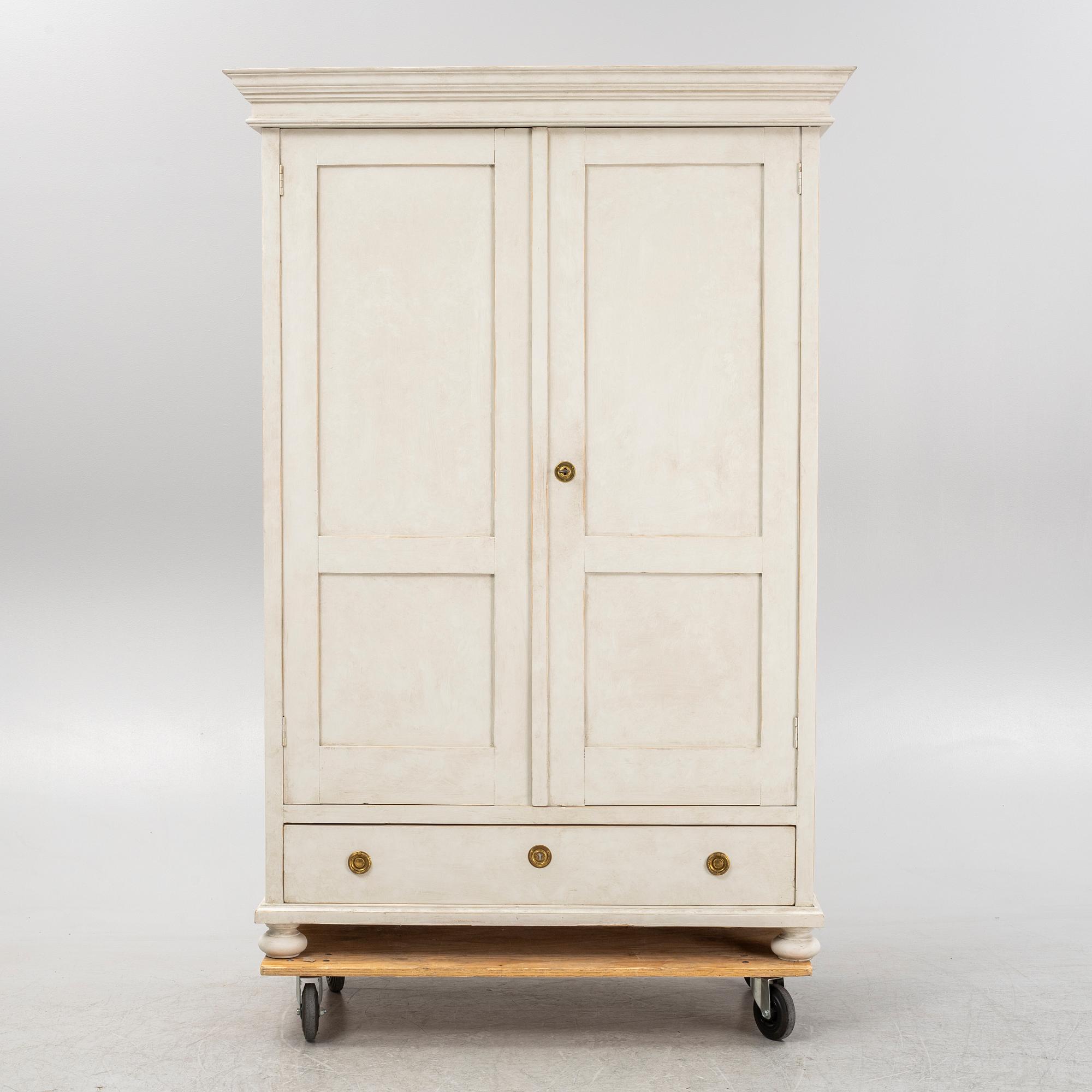 A painted clothes cabinet, 21st Century.