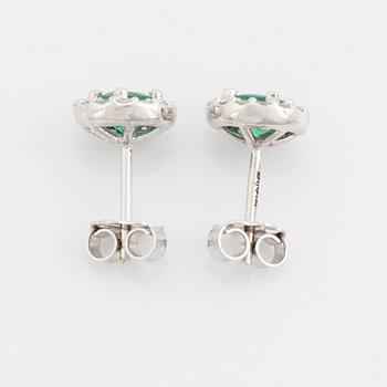 Emerald and brilliant cut diamond earrings.
