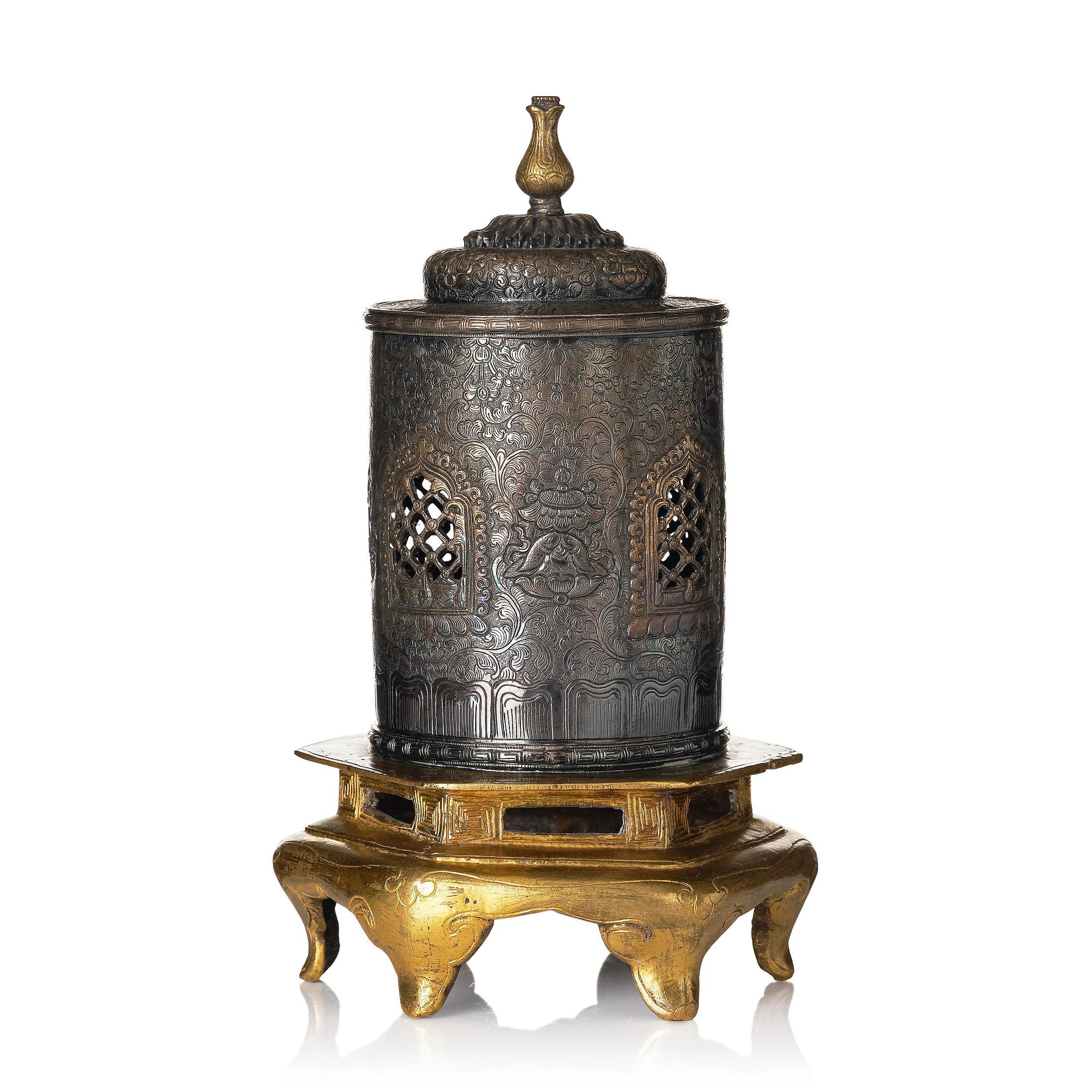 A silvered brass prayer container, Tibet, 20th century.
