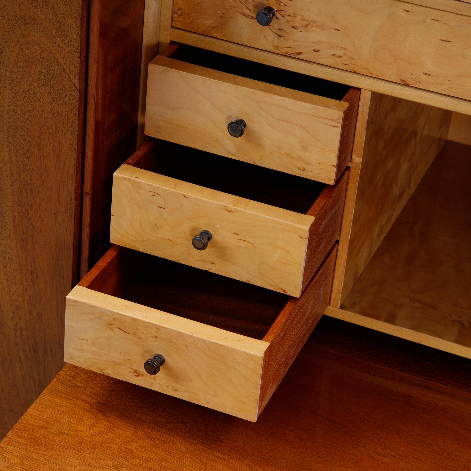 A 1940's Swedish Modern mahogany veneered cabinet.
