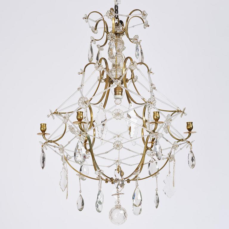 A seven-light gilt brass and cut glass rococo chandelier, mid 18th century.