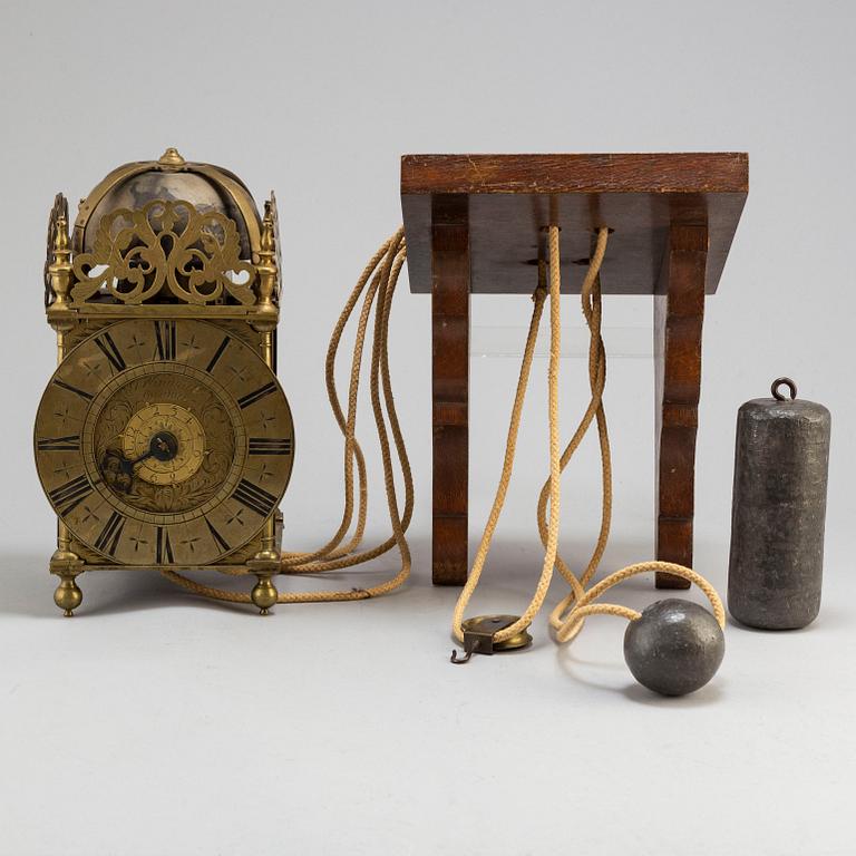 A late 17th or early 18th century lantern clock signed J Windmills London.