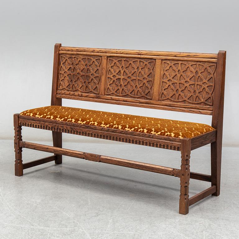 A 20th century renaissance style sofa.