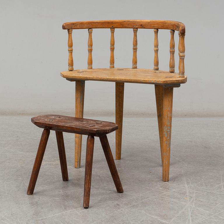 a swedish wooden chair with a stool from the 19th century.