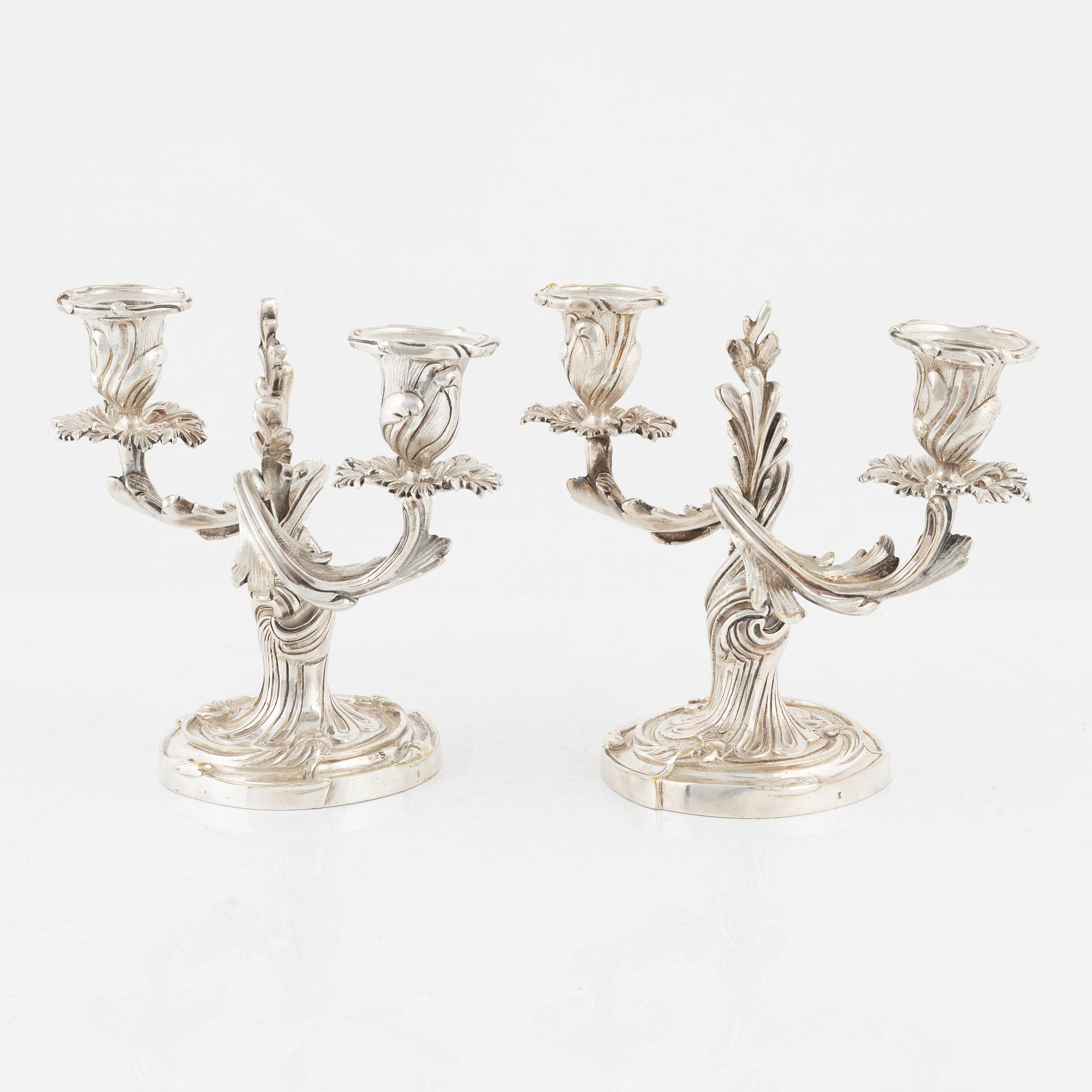A rococo style pair of silverplated candelabras, end of the 19th Century..