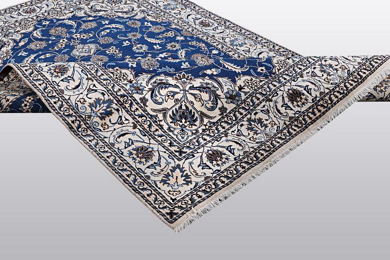 A carpet, Nain, part silk 9 LAA, ca 310 x 203 cm.