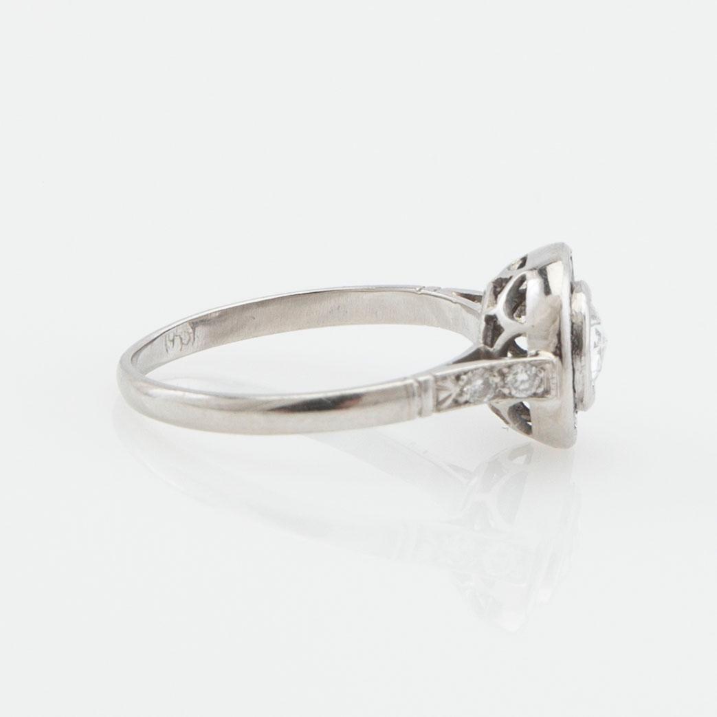 Halo ring, platinum with rose-cut diamond and sapphires.