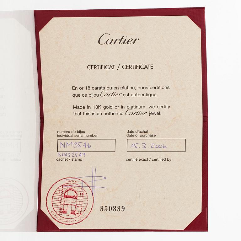 Cartier, an 18K white gold 'Love' ring with three brilliant-cut diamonds.