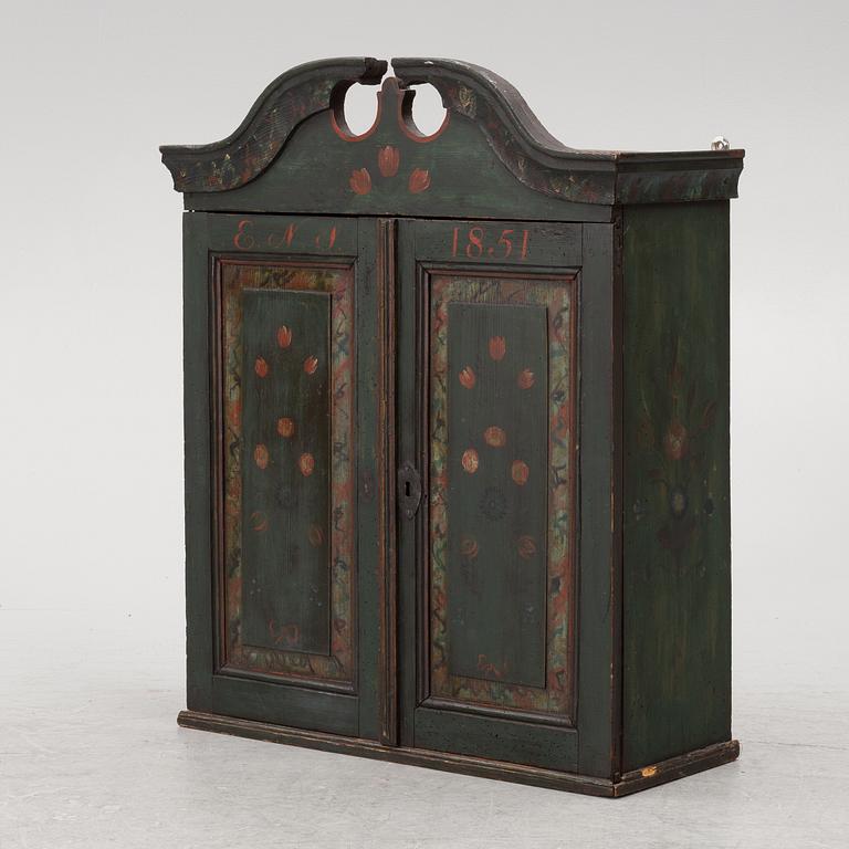 A wall-hanged cabinet, Sweden, dated 1851.