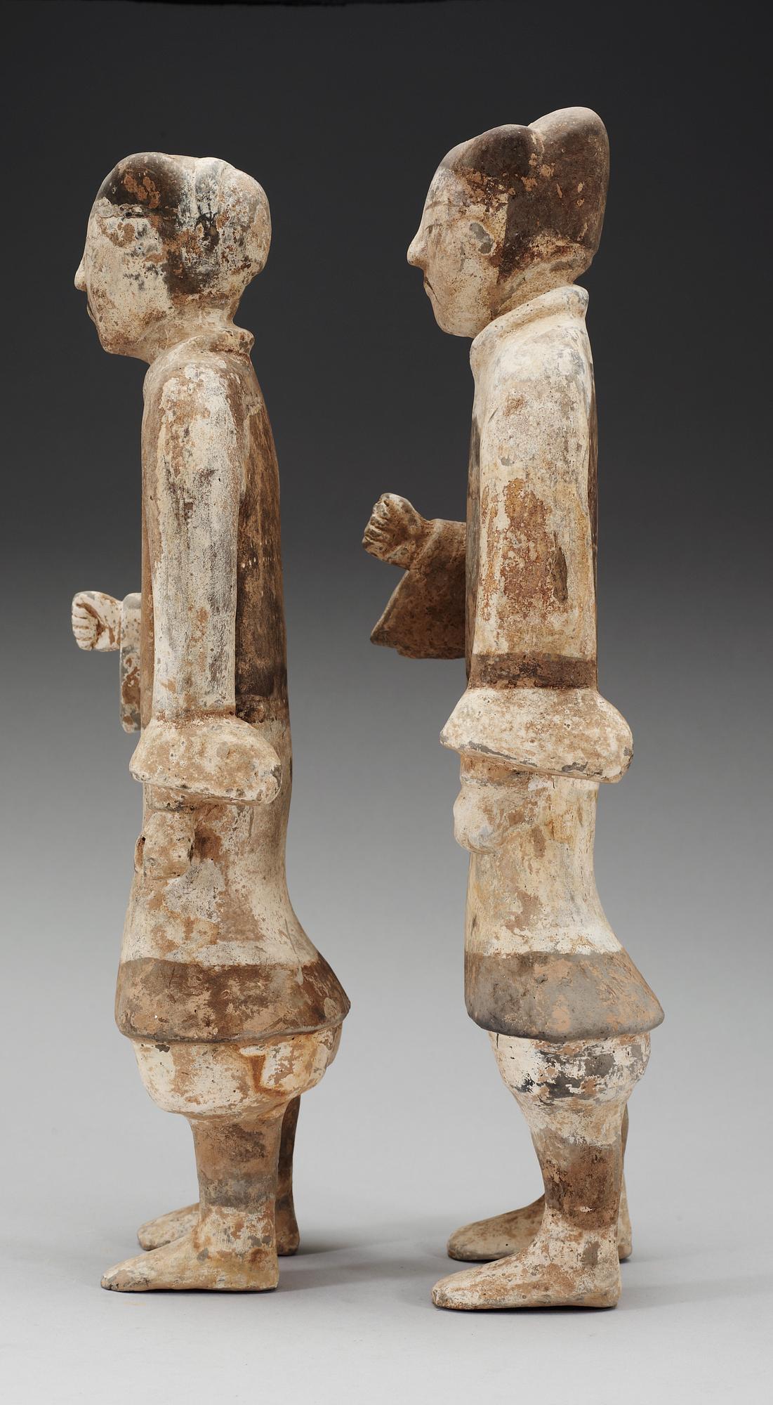 Two painted pottery figurines of standing soldiers, Han dynasty (206 BC- 220 AD).