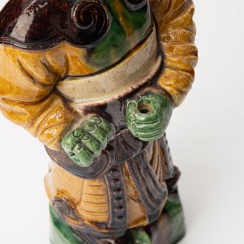 A stoneware figurine, China, Ming style but 20th century.