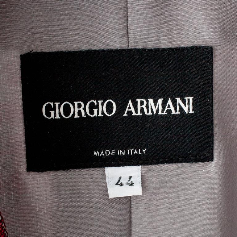 GIORGIO ARMANI, a three-piece suit consisting of jacket, pants and topp.