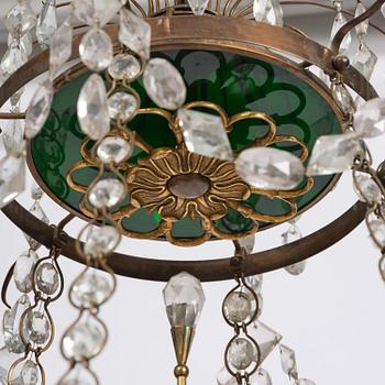 A Late gustavian green top glass six light chandelier.