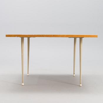 A coffee table marked Tapio Wirkkala, Asko, Made in Finland.