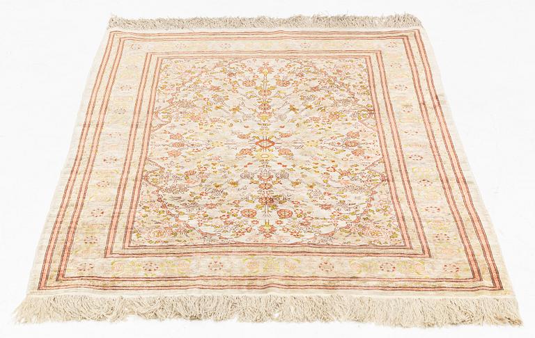 A Hereke silk rug, c. 130 x 87 cm.