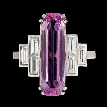 851. A pink topaz, 4.64 cts and baguette-cut diamond, total carat weight 0.32 ct, ring.