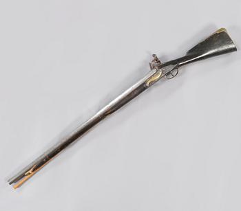 A flintlock rifle, 18th century.