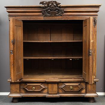 A walnut veneered Baroque cabinet, from around the year 1700.