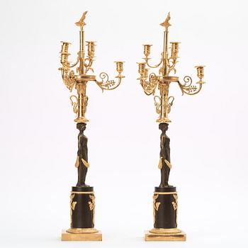 A pair of Empire early 19th century six-light candelabra.