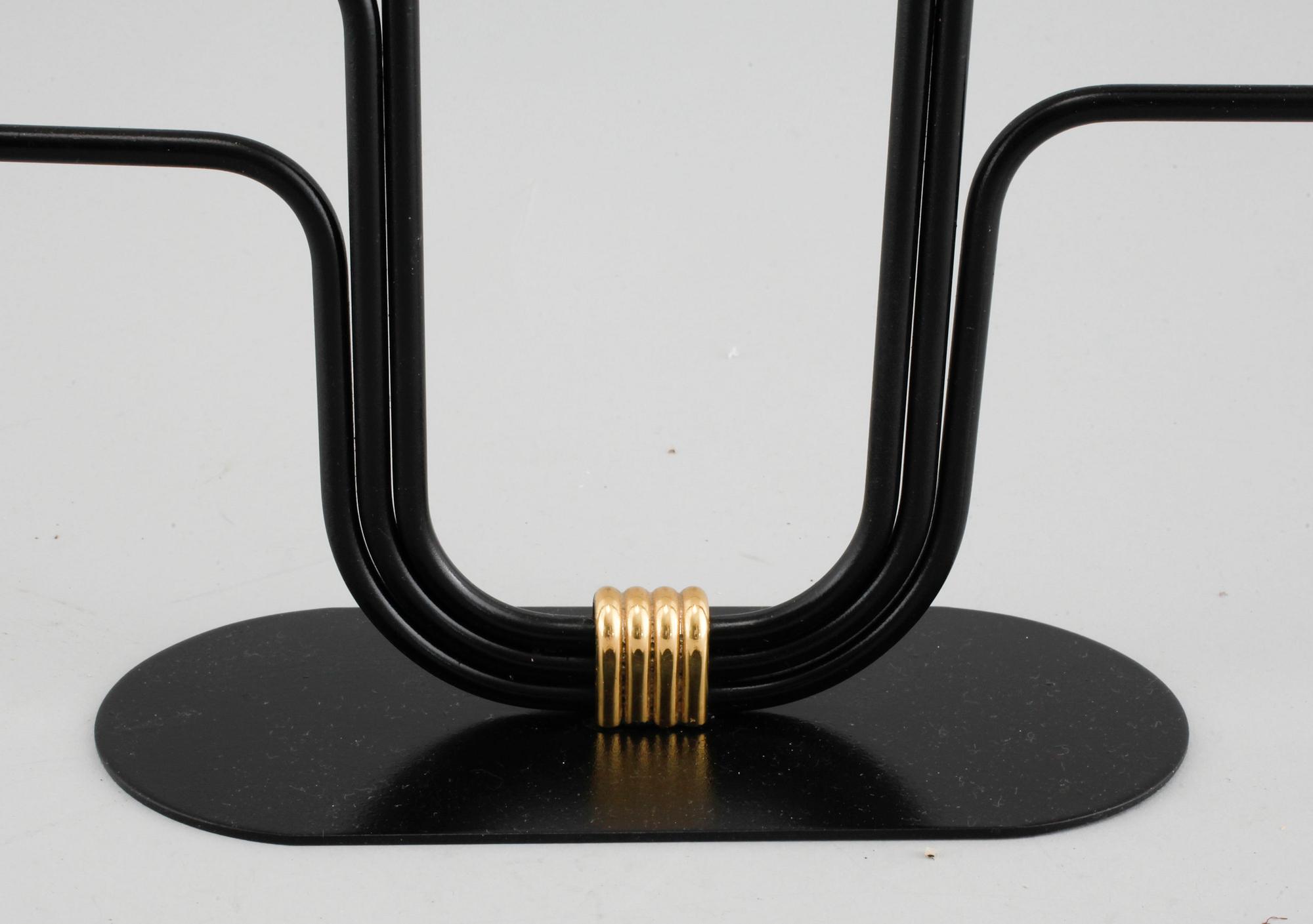A candelabrum and one camdelstick by Gunnar Ander for Ystad Metall, 20th century.