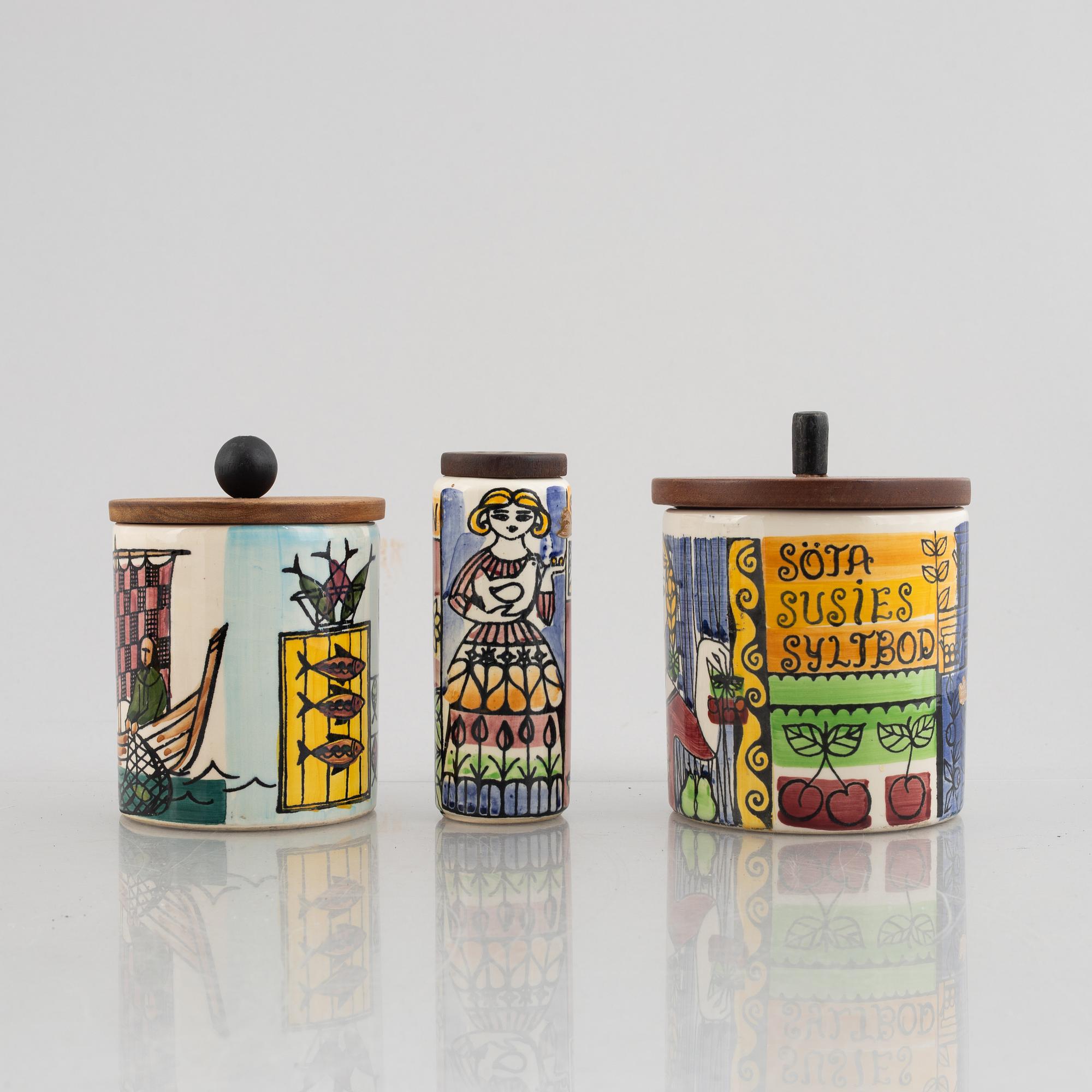 A set of five creamware jars with covers and a sugar caster,  including Anita Nylund, 'Vår lilla stad', Jie, Gantofta.