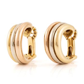 612. Cartier a pair of "Trinity" earrings in 18K gold in three colours.