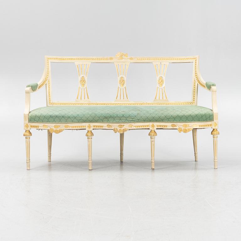 A painted and carved Gustavian style sofa, 1920's.