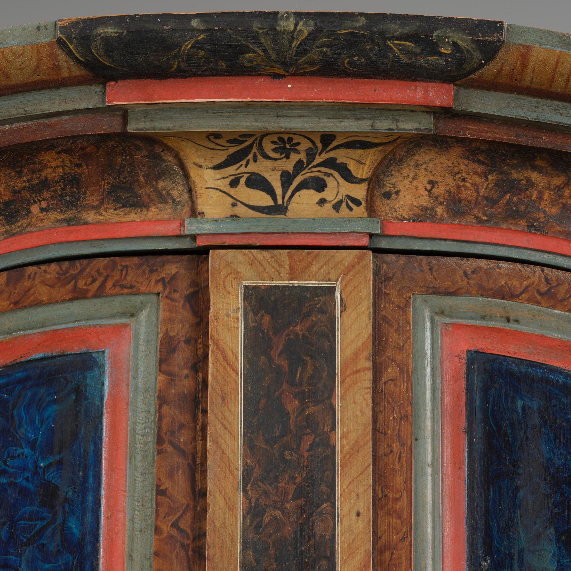 A polychrome-painted folk art cabinet from Värmland, Sweden, dated 1818.