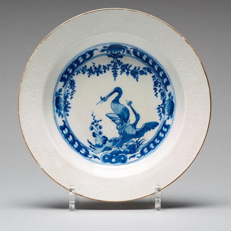 A set of eight blue and white armorial soup dishes, Qing dynasty, 18th Century.