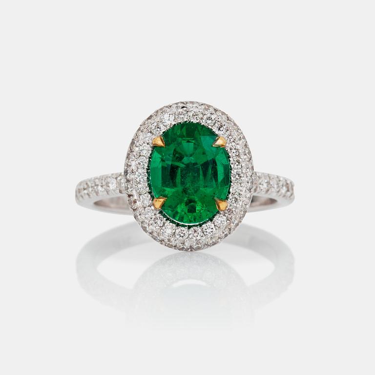 A 1.71-ct Zambian emerald (minor oil) and pavé-set diamond ring. Total carat weight of diamonds 0.65 cts.