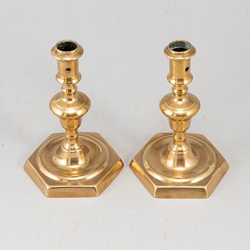 A pair of 17th century bronze candlesticks.