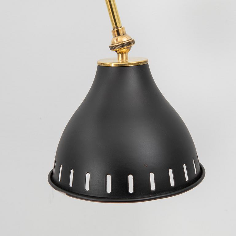 A bras wall lamp later part of the 20th century.