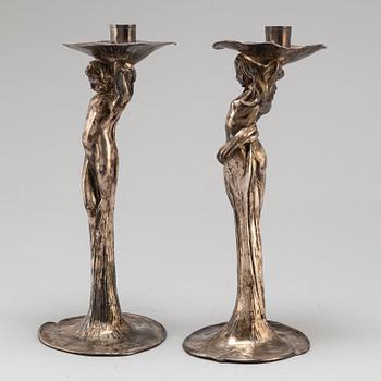 A 20th Century pair of art noveau style candle sticks marked A.W.OX.