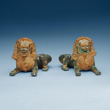 1866. A pair of Burmese/Thai gilt bronze figures of buddhist lions, late 19th Century.