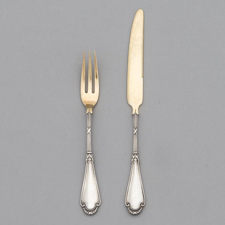 A set of Fabergé parcel-gilt silver dessert cutlery, 11 pieces + one fork later manufactured by Kultakeskus, Finland.