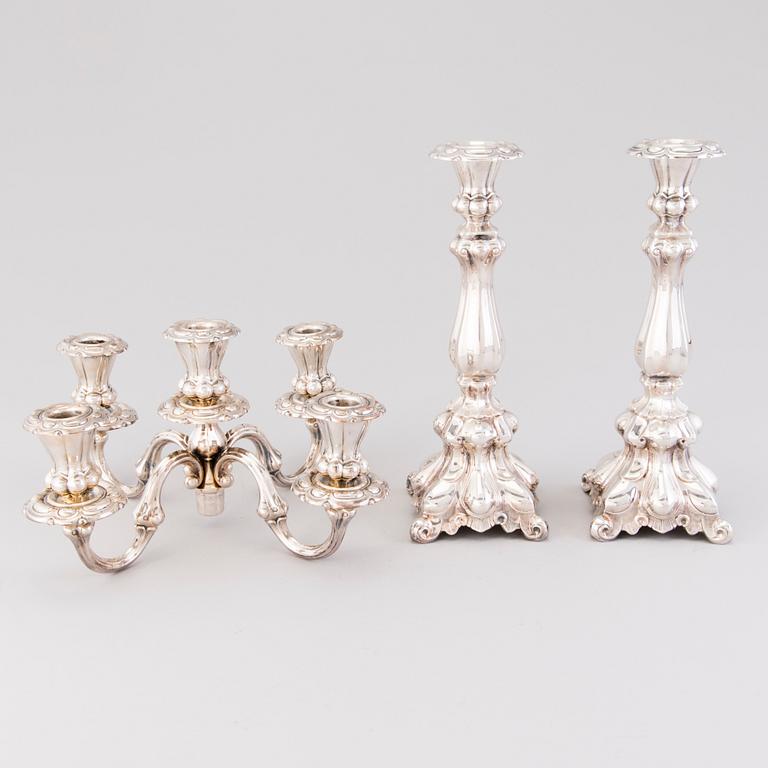 CANDELABRUM AND CANDLESTICK, silver, Kultakeskus Oy, Hämeenlinna, 1965 and 1975.