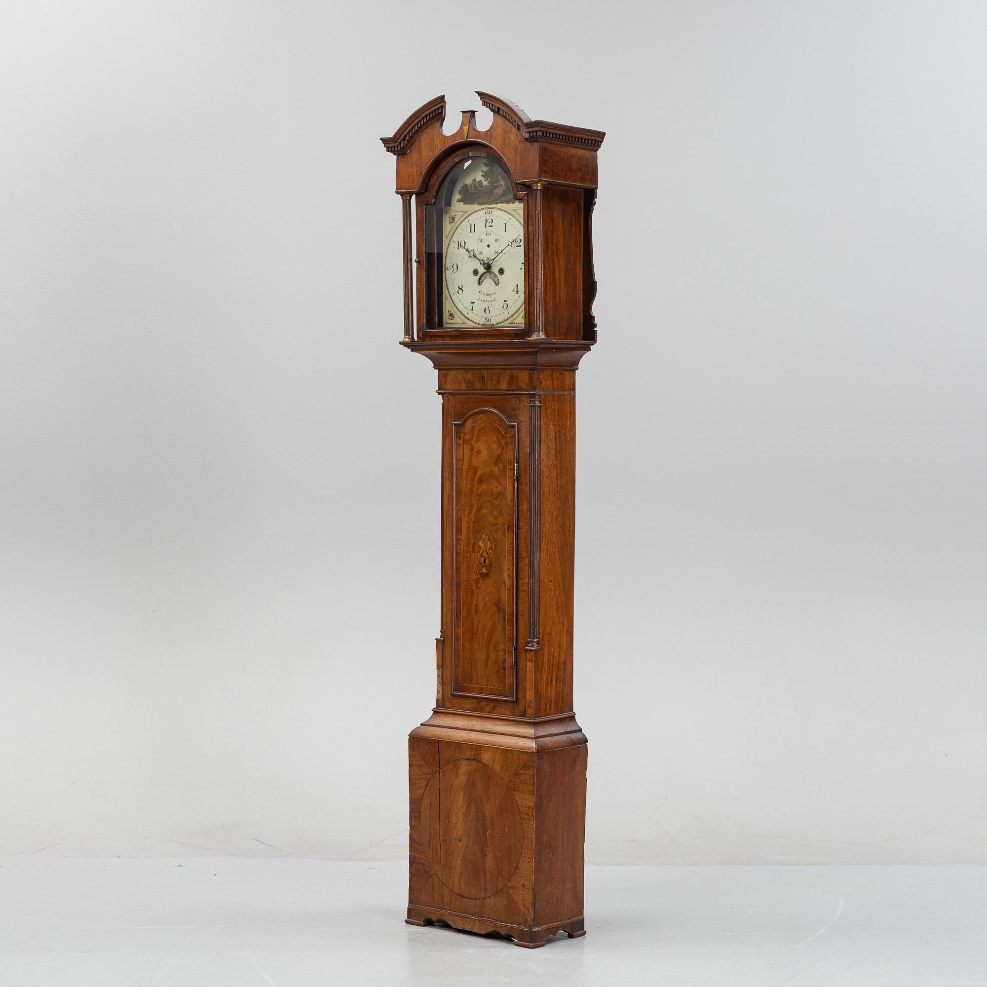 A mahognay long case clock from around the year 1800, H Bunyan Lincoln.