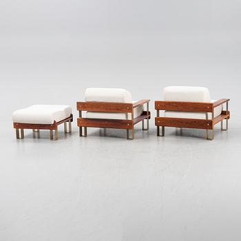 A pair of rosewood armchairs and a foot stool, 1970's.