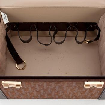 CHRISTIAN DIOR, a brown leather monogrammed beautybox from the 1970s.