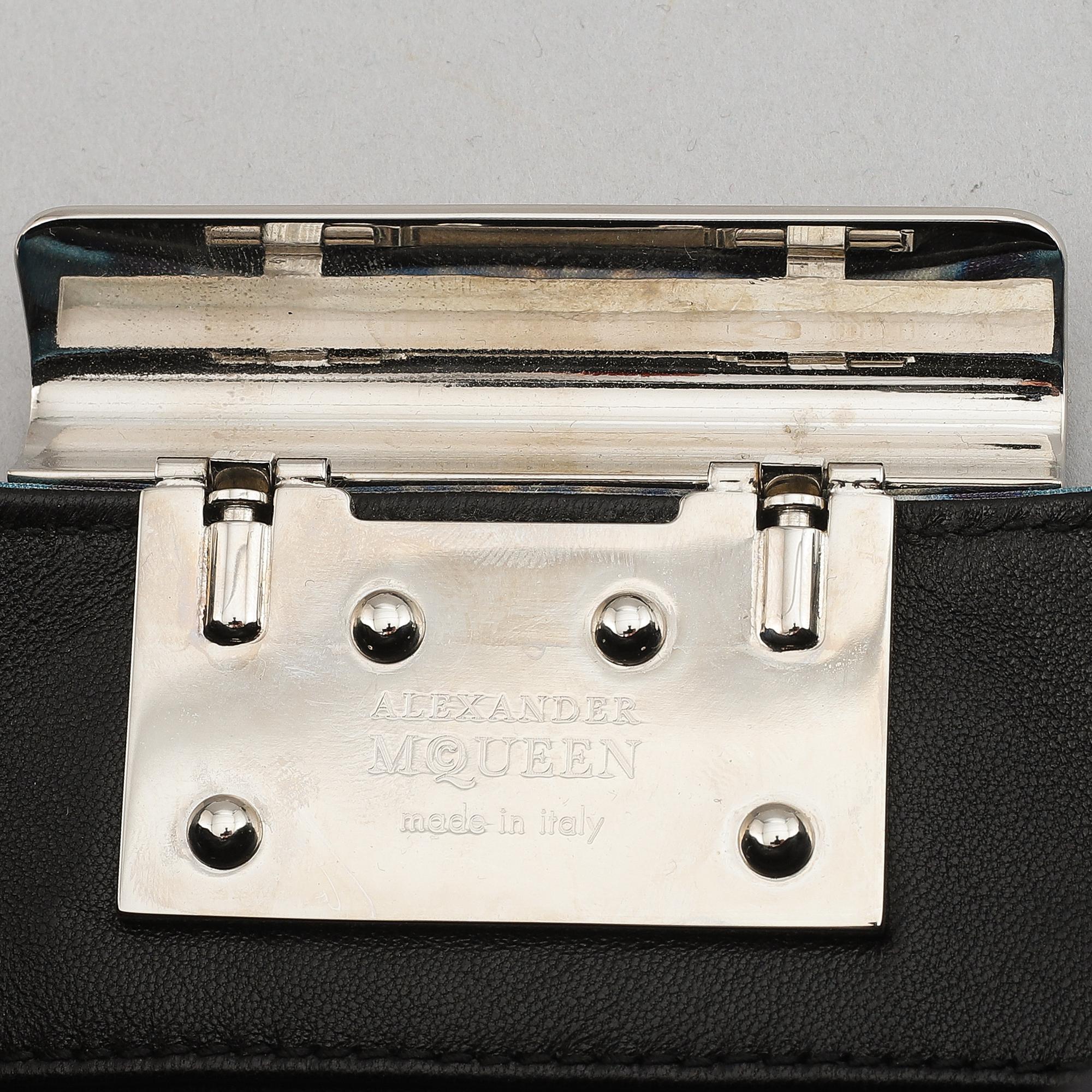 Alexander McQueen, a fabric clutch.