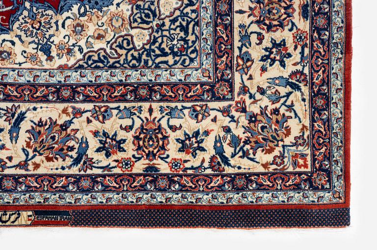 A semi-antique Isfahan rug, Central Persia, signed (Sadegh) Seirafian, c. 237 x 146 cm.