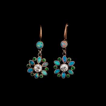 1067. A pair of opal earrings set with demantoid garnets and old-cut diamonds.