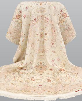 A Tabriz part silk carpet, signed, 305 x 203 cm.