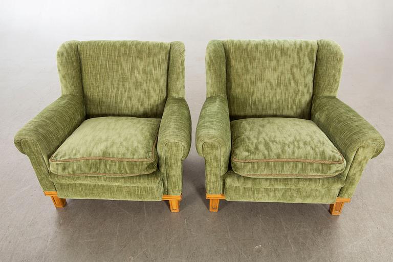 A pair of Swedish Modern lounge chairs.