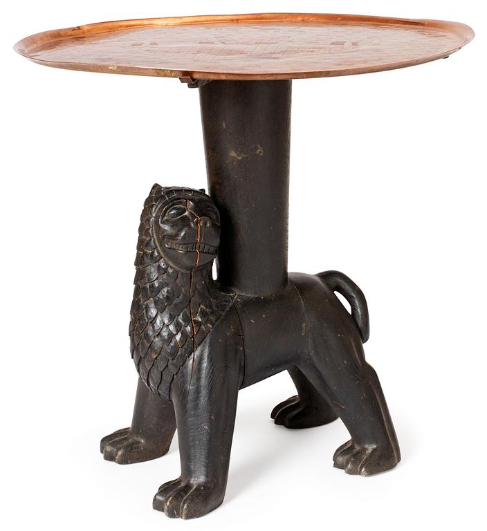 An Anna Petrus table, Sweden early 1920's. Sculptured oak with an engraved copper tray.