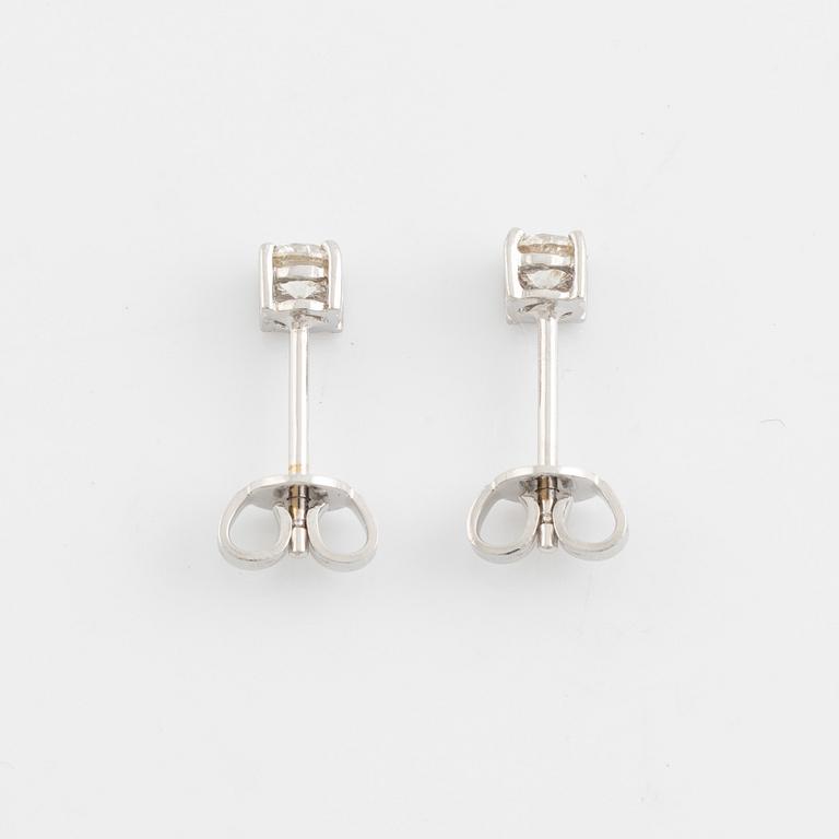 Brilliant cut diamond stud earrings.